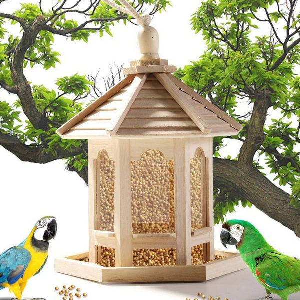 Transparentes hölzernes Vogelhaus für den Garten