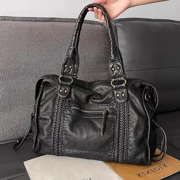 Schwarze Handtasche für den Unterricht